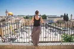 woman looking over balcony in Israel